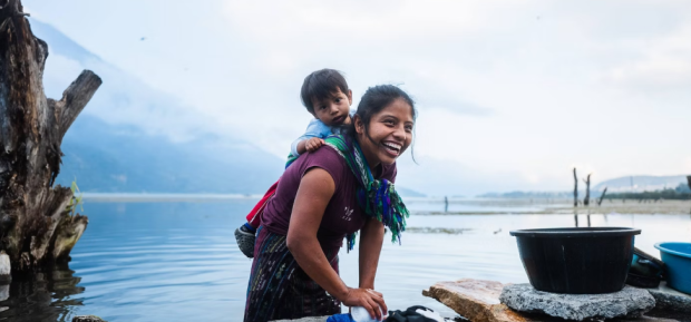Mother carrying a child